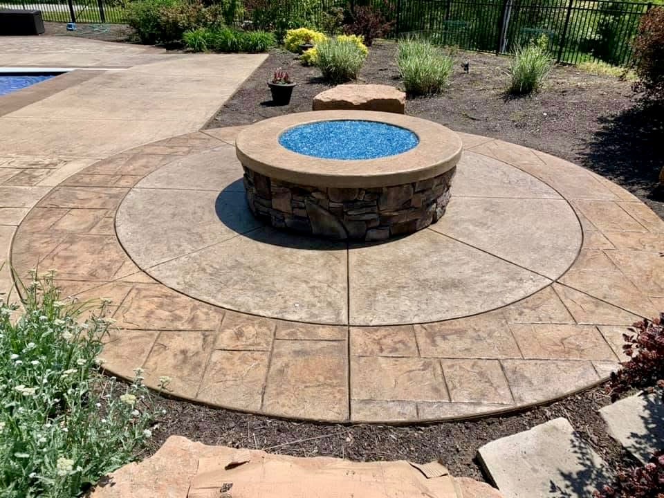 Circular decorative concrete around a pool feature